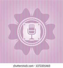 microphone icon inside retro style pink emblem
