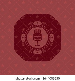 microphone icon inside retro style red emblem