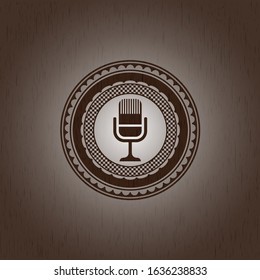 microphone icon inside retro wood emblem