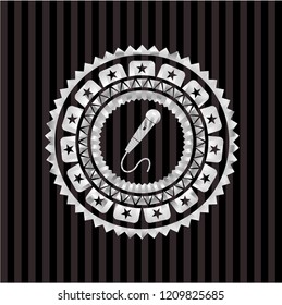 microphone icon inside silver badge or emblem