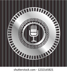 microphone icon inside silver badge or emblem