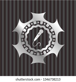 microphone icon inside silver badge or emblem