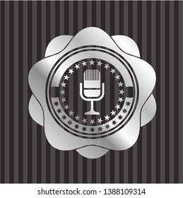 microphone icon inside silver badge