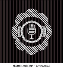 microphone icon inside silver badge or emblem