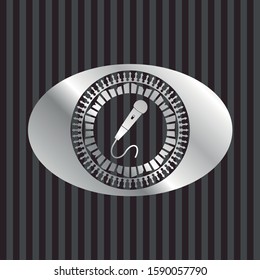 microphone icon inside silver badge or emblem