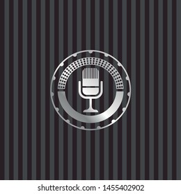 microphone icon inside silver emblem