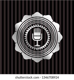 microphone icon inside silvery badge