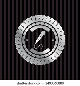 microphone icon inside silvery emblem or badge