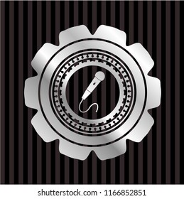 microphone icon inside silvery shiny emblem