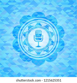 microphone icon inside sky blue mosaic emblem