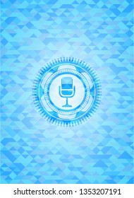 microphone icon inside sky blue emblem. Mosaic background