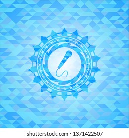 microphone icon inside sky blue emblem with mosaic background