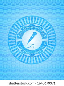 microphone icon inside sky blue water style badge.
