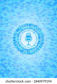 microphone icon inside sky blue emblem. Mosaic background. 