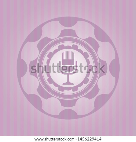 microphone icon inside vintage pink emblem