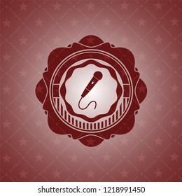 microphone icon inside vintage red emblem