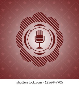 microphone icon inside vintage red emblem