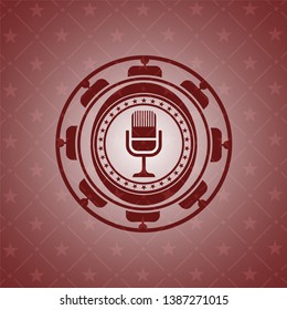microphone icon inside vintage red emblem