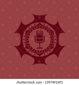 microphone icon inside vintage red emblem