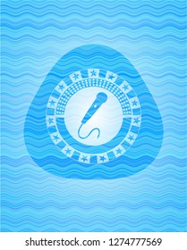 microphone icon inside water wave concept emblem background.