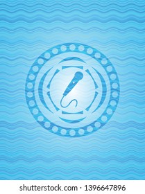 microphone icon inside water wave representation emblem background.