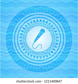 microphone icon inside water wavec oncept emblem.