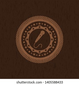 microphone icon inside wood badge or emblem