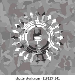 microphone icon on grey camouflage pattern