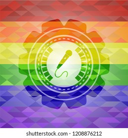 microphone icon on mosaic background with the colors of the LGBT flag
