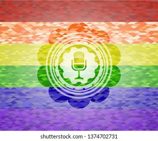 microphone icon on mosaic background with the colors of the LGBT flag