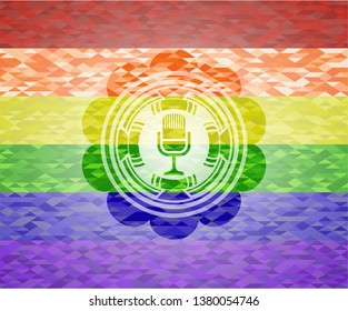 microphone icon on mosaic background with the colors of the LGBT flag