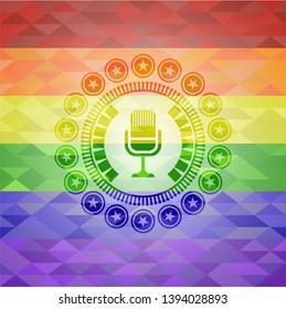 microphone icon on mosaic background with the colors of the LGBT flag