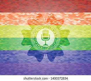microphone icon on mosaic background with the colors of the LGBT flag