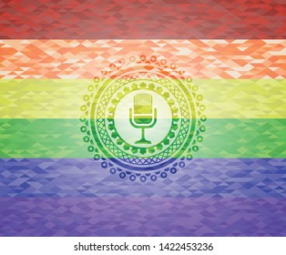 microphone icon on mosaic background with the colors of the LGBT flag