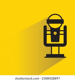 microphone on stand icon with drop shadow on yellow background