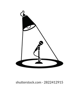 Microphone on stand under bright spotlight