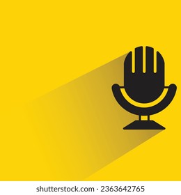 microphone on stand on yellow background