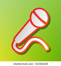 Microphone sign illustration. Contrast icon with reddish stroke on green backgound.
