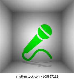 Microphone sign illustration. Vector. Green icon with shadow in the room.