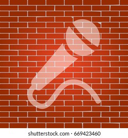 Microphone sign illustration. Vector. Whitish icon on brick wall as background.