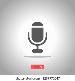 microphone. simple silhouette. Icon under spotlight. Gray background