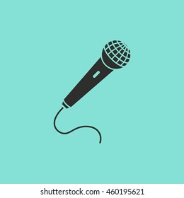 Microphone vector icon. Black illustration isolated on green background for graphic and web design.