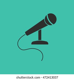 Microphone vector icon. Black illustration isolated on green background for graphic and web design.