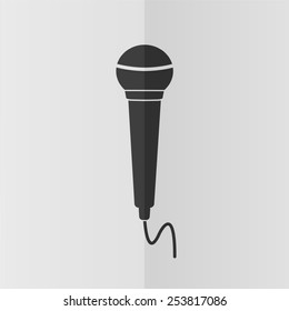 Microphone vector icon. Effect of folded paper. Flat design