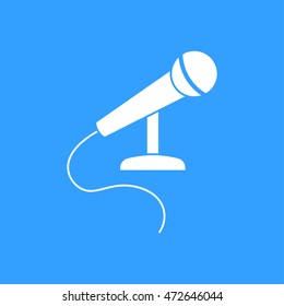 Microphone vector icon. White illustration isolated on blue background for graphic and web design.