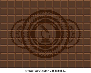 microscope icon inside chocolate bar emblem. Brown luxurious background. Intense illustration. 