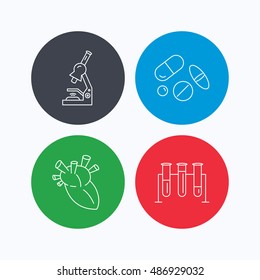 Microscope, medical pills and heart icons.
