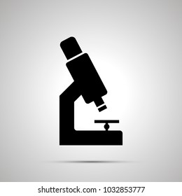 Microscope silhouette, simple black icon with shadow