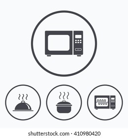 Microwave grill oven icons. Cooking pan signs. Food platter serving symbol. Icons in circles.