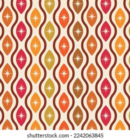 Mid century modern atomic starburst seamless pattern on ogee oval shapes in orange, red, brown, yellow and tangerine. For home decor, textile and wallpaper